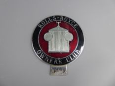 A Rolls-Royce Owners Club membership badge, enamel on chrome plated brass, outer ring with name on