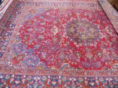 A Large 20th Century Persian Wool Carpet, jewel colours of intricate foliate and eternal flame