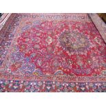 A Large 20th Century Persian Wool Carpet, jewel colours of intricate foliate and eternal flame