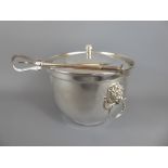 A Silver Plated Ice Bucket and Cover with lion mask handles, together with tongs. (2)