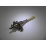 A Victorian Silver Rattle with mother of pearl handle.