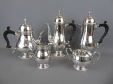 A Five Piece Silver Tea and Coffee Set, comprising tea pot, coffee pot, hot water pot, sugar bowl