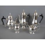 A Five Piece Silver Tea and Coffee Set, comprising tea pot, coffee pot, hot water pot, sugar bowl