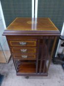 An Edwardian Inlaid Mahogany Revolving Bookcase. The bookcase having book storage on two levels with