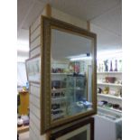 BEVELLED GLASS MIRROR IN DECORATIVE FRAME