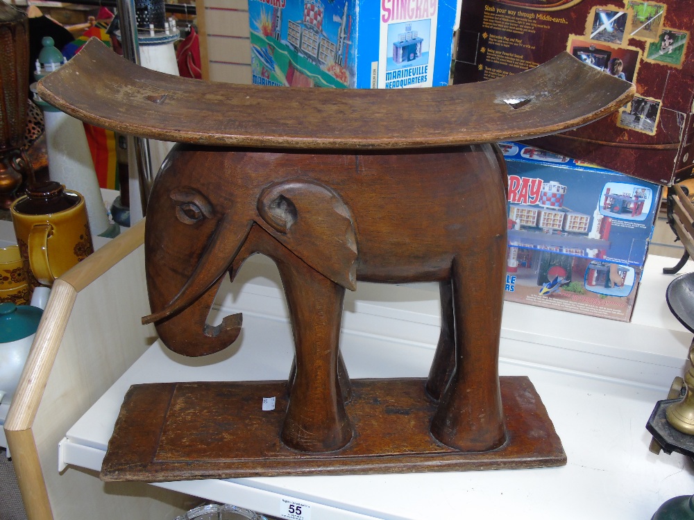 AN ASHANTI TRIBAL STOOL, BASE CARVED WITH AN ELEPHANT