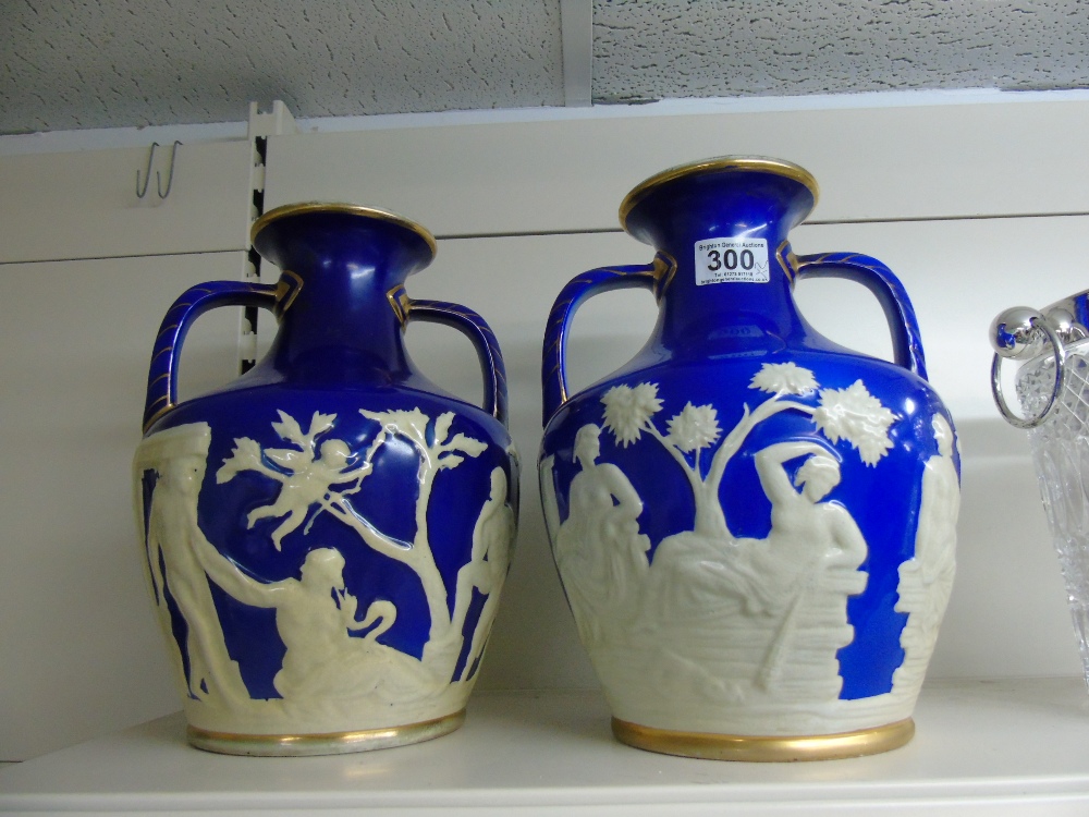 PAIR OF PORTLAND POTTERY TWIN HANDLES VASES WITH CLASSICAL SCENES 28 CMS HIGH