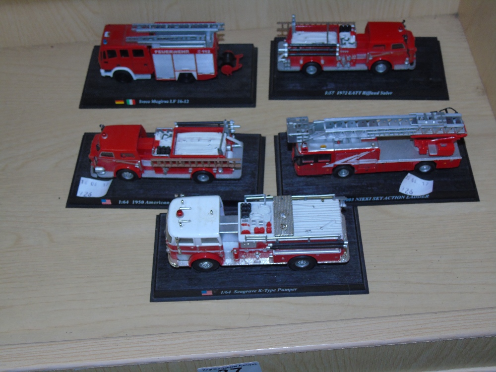 QUANTITY OF FIRE ENGINES ON DISPLAY STANDS