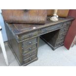 ANTIQUE OAK PEDESTAL DESK WITH CARVED DRAWER FRONTS