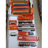 QUANTITY OF TOY TRAINS AND CARRIAGES INCLUDING HORNBY AND TRI-ANG