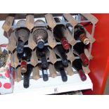 12 ASSORTED BOTTLES OF WINE ON A METAL & WOOD RACK