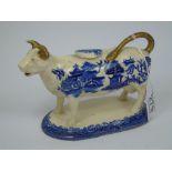 LATE 19TH CENTURY BLUE WILLOW PATTERN COW CREAMER