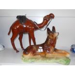 PORCELAIN FIGURE OF AN ALSATIAN DOG AND A LEATHER CAMEL