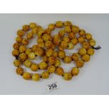 2 STRINGS OF ORIENTAL CARVED BONE PRAYER BEADS