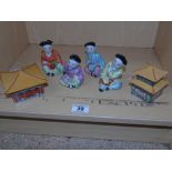 4 ORIENTAL CERAMIC FIGURES & 2 MUSICAL BOXES IN THE FORM OF PAGODAS