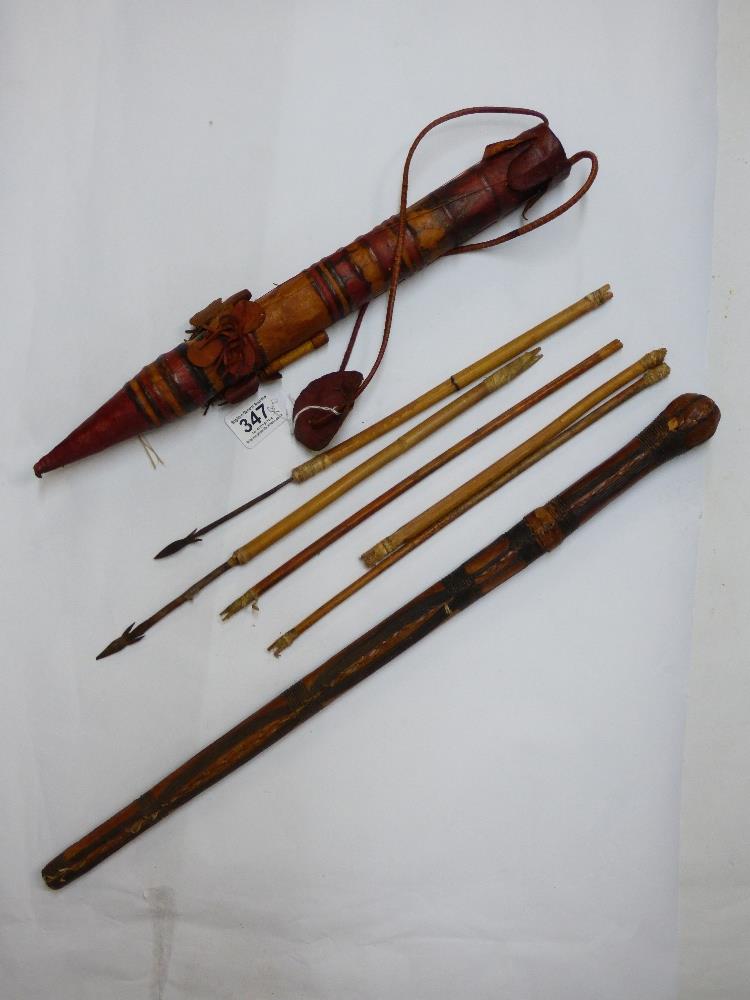 AN ETHNIC QUIVER WITH ARROWS & LEATHER BOUND CLUB