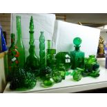 LARGE QUANTITY OF GREEN GLASS ITEMS INCLUDING VASES AND A DECANTER