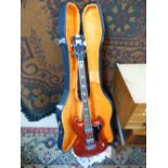 JAPANESE BASS GUITAR WITH HARD CASE AND COLLECTION OF STRINGS