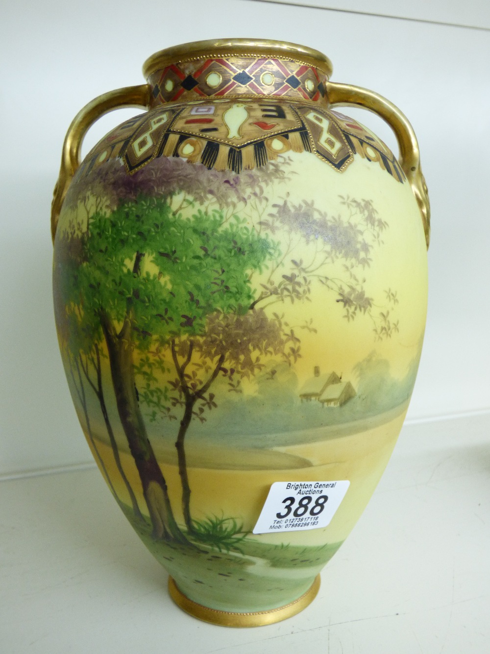 VASE DECORATED WITH A COUNTRY SCENE & HAVING GILDED HANDLES 32 CMS HIGH