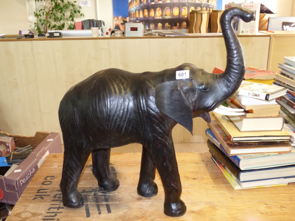 1940'S LEATHER CLAD ON STRAW & TIMBER MODEL OF A LEATHER ELEPHANT 65CM LONG X 70CM HIGH