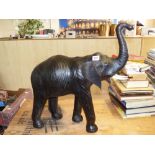 1940'S LEATHER CLAD ON STRAW & TIMBER MODEL OF A LEATHER ELEPHANT 65CM LONG X 70CM HIGH