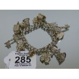 HALL MARKED SILVER BRACELET & CHARMS 49.62 GRAMS