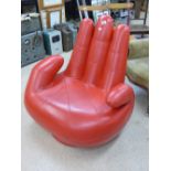RED ARMCHAIR IN THE SHAPE OF A HAND