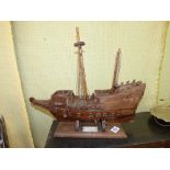 EARLY 20TH CENTURY SCRATCH BUILT IN OAK MODEL OF THE GOLDEN HIND ON STAND