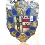 A LEAD AND STAINED GLASS PANEL SHOWING TWO COATS OF ARMS AND THE INSCRIPTION, A SON OF WAKELYN