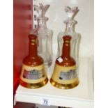 2 MATCHING GLASS DECANTERS & 2 WADE BELLS