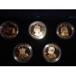 Boxed set of 5 Golden Jubilee gold plated cu-ni dollars from East Caribbean States showing the