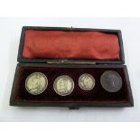 A cased set of 1892 Maundy Money to include three coins and an 1844 half farthing