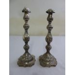 A pair of silver table candlesticks, knopped stem on shaped square bases, London 1926