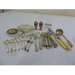 A quantity of silver to include a coaster, flatware and condiments