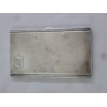 A rectangular engine turned silver hallmarked cigarette case