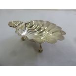 An Irish silver shell shaped bonbon dish on three scroll legs, Dublin 1973