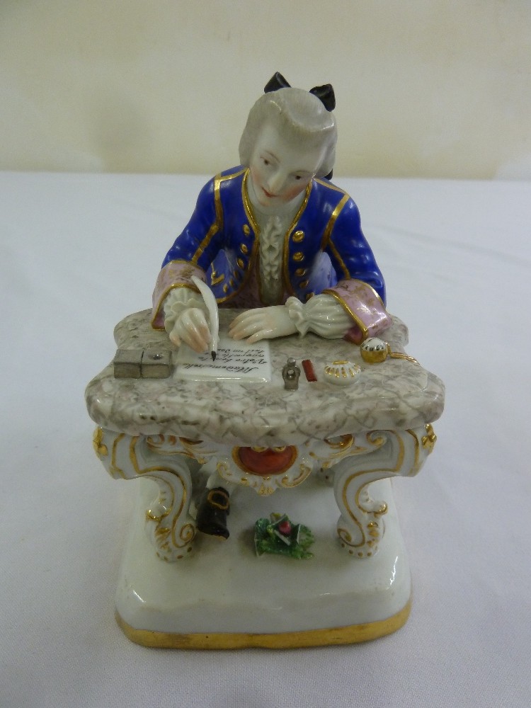 A Meissen figurine of a gentleman writing at his desk, marks to the base, 15cm (h)