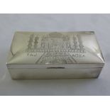 An Indian rectangular white metal cigarette box, wood lined, the raised hinged cover engraved with