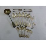 A quantity of Irish silver antique fiddle pattern flatware to include a soup ladle, six table