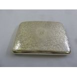 An Edwardian rounded rectangular silver hinged cheroot case, profusely engraved with leaves and