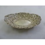 A Victorian silver oval bonbon dish, floral and leaf chased sides, London 1894