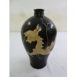 An early 20th century Chinese black ground vase decorated with a dragon