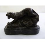 A bronze figurine of a tiger on raised marble plinth, signed Barie