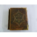 A leather bound Holy Bible with brass corners and clasp, A/F