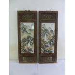 A pair of Chinese Republic period painted porcelain panels of landscapes in hardwood frames, 94 x