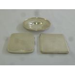 Two engine turned silver cigarette cases and a white metal pin tray