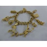 9ct yellow gold charm bracelet with nine charms and a padlock clasp, approx total weight 87.0g