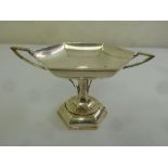 A silver hexagonal trophy cup with two angled side handles on raised hexagonal base, Sheffield