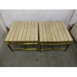 A pair of 1970s rectangular marble topped side tables with inlaid brass strips on a gilded brass