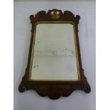 A late 19th century mahogany rectangular wall mirror with pierced gilt mounts, 83 x 50.5cm